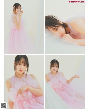 A woman in a pink dress posing for a picture.